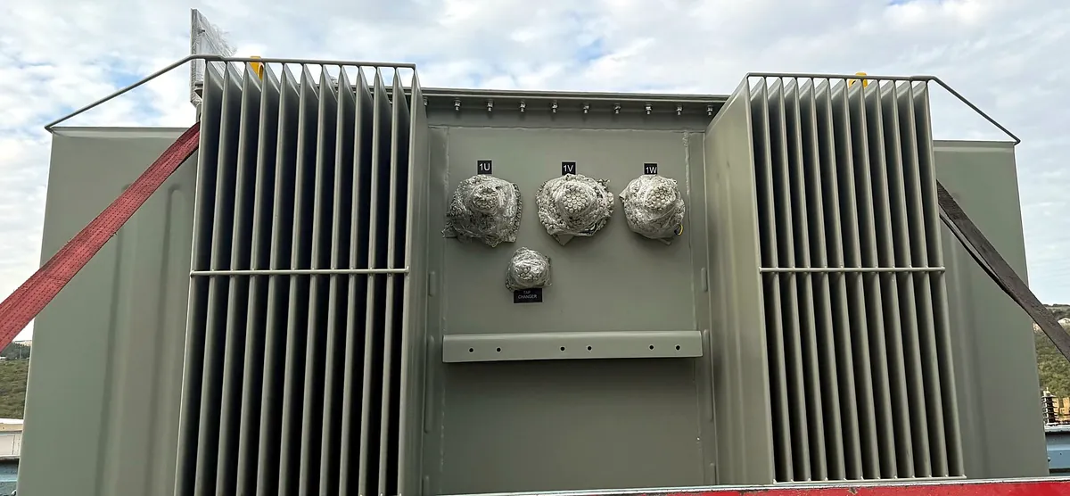 Transformer cable-connection side with protected terminals